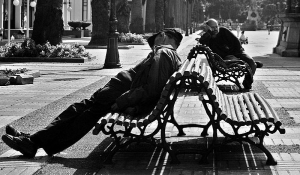 A couple of guys sleeping near the Kiosko Alfonso in A Coruña (Galicia, Spain). Photo by Julio Rojas.